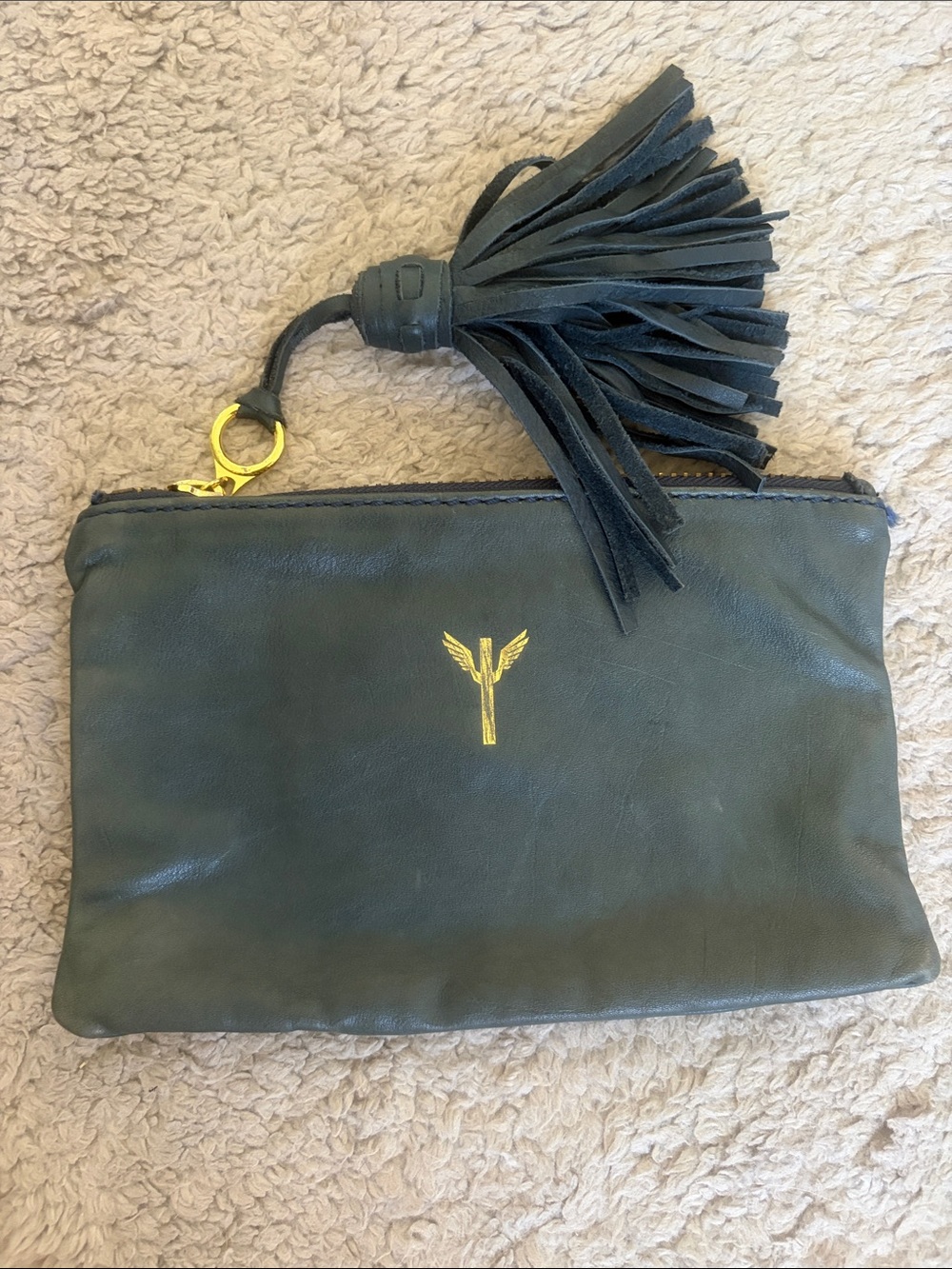 Pour La Victoire Navy Blue Leather Tassel Clutch
Pouch with Gold Winged Logo